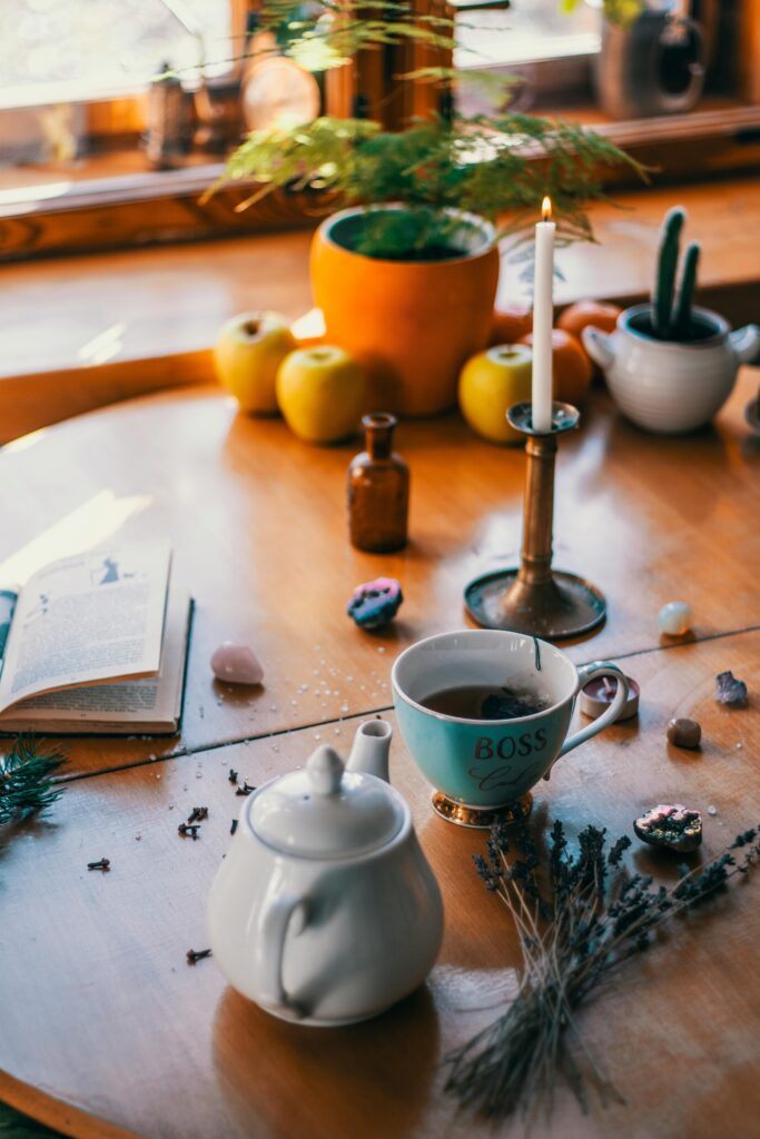 tea cup and teapot on wooden table